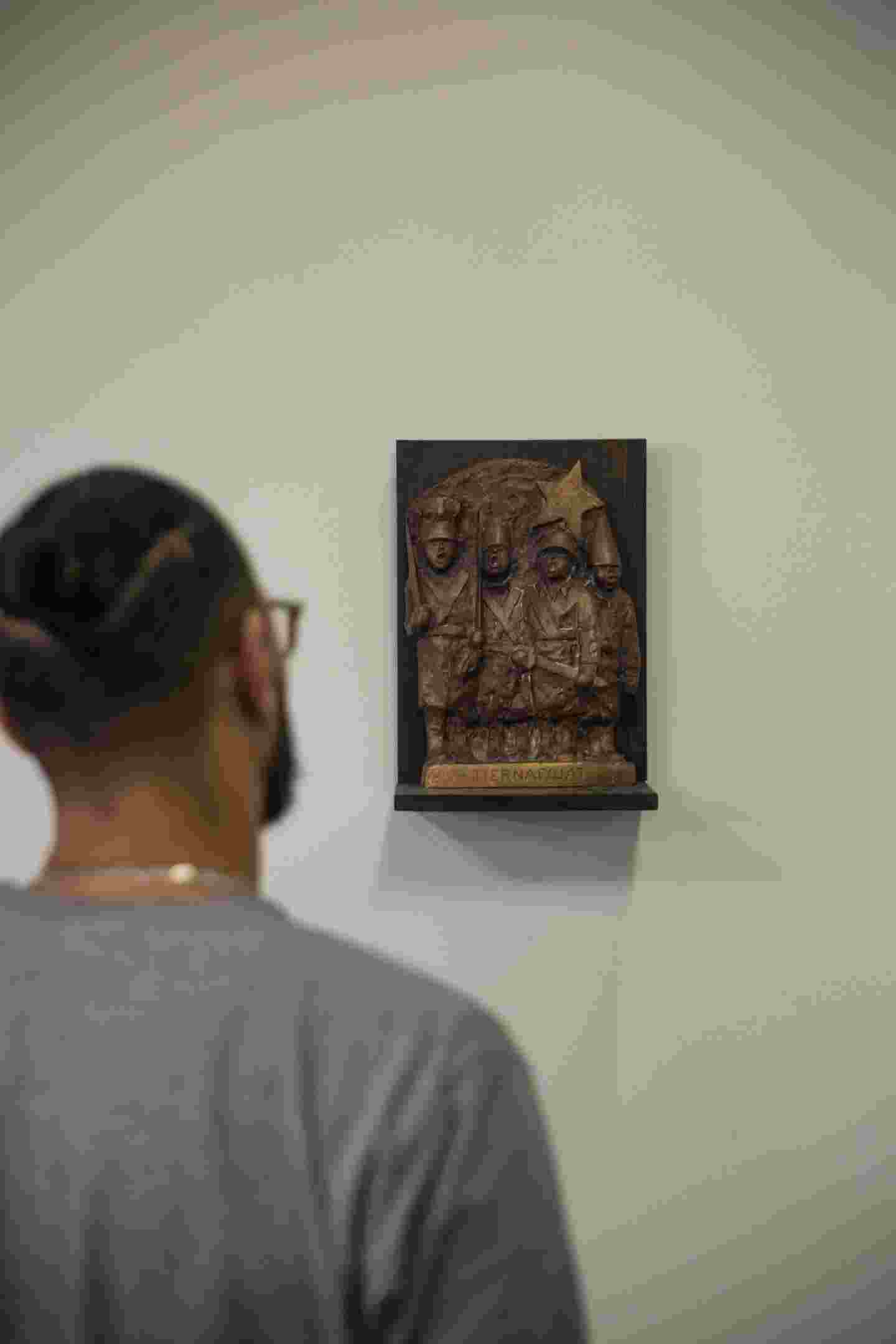 A person looking at an artwork.