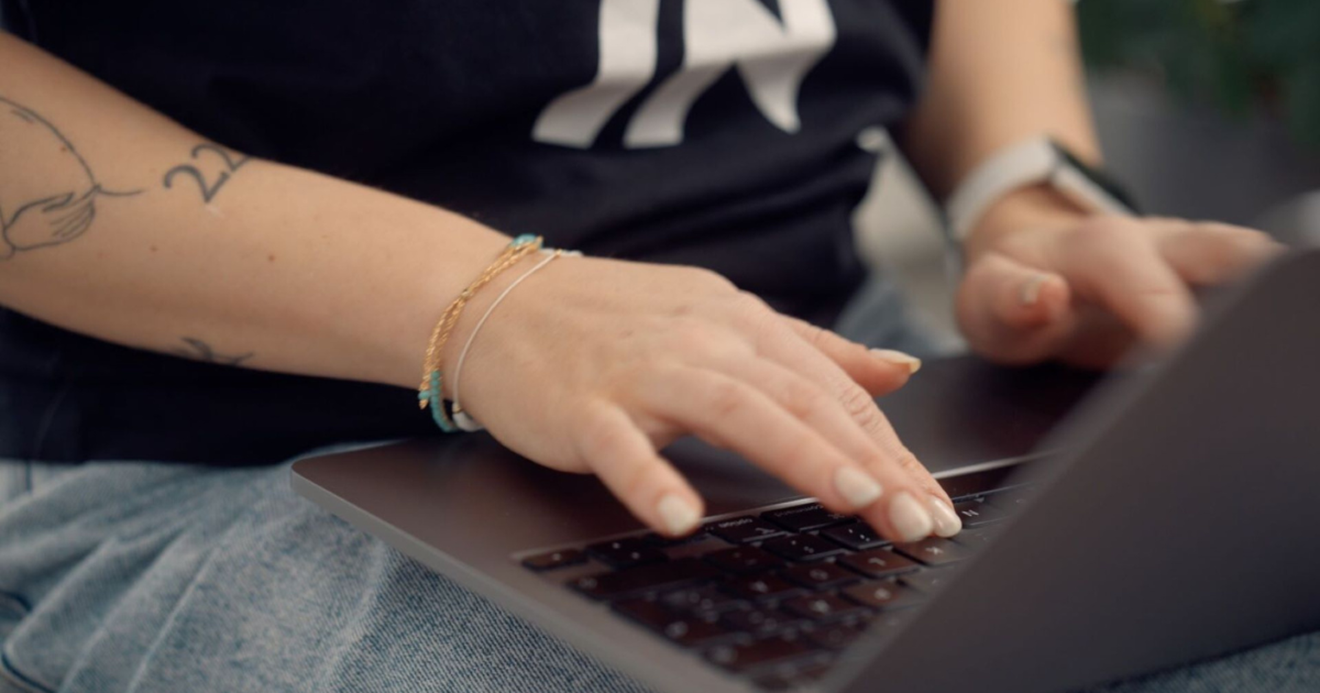 A close-up of fingers on a keyboard.